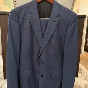 Navy Blue Suit with Structured Fabric and Notched Lapels. New